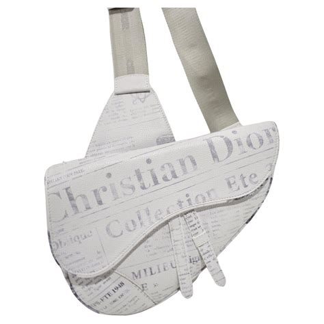 white newspaper print dior and daniel arsham calfskin saddle bag|Daniel Arsham Newspaper Print Saddle Bag White.